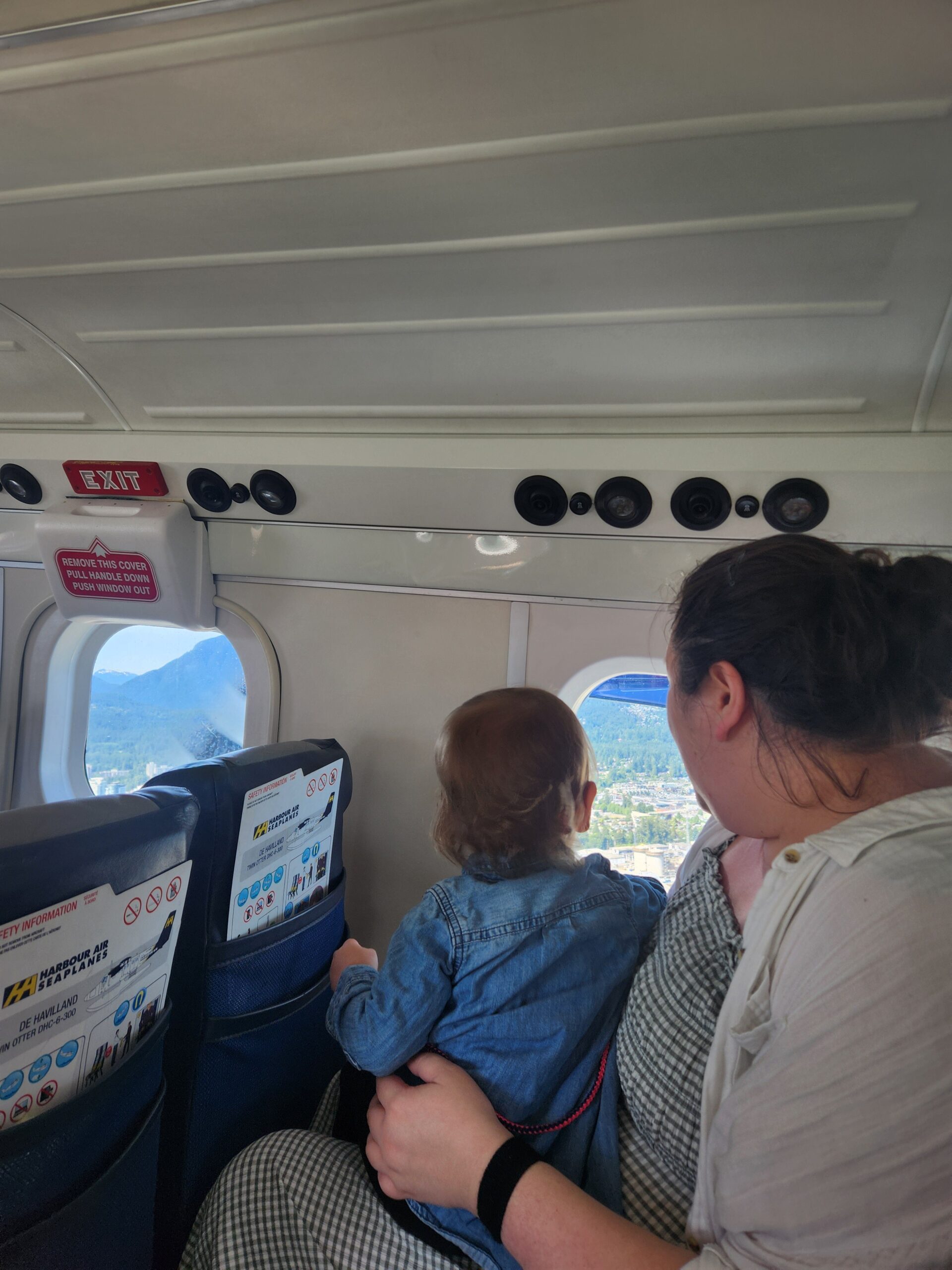 Should You Take a Seaplane to Victoria from Vancouver? (Harbour Air Review) 20 Riana and Baby C looking out the window on their Habour Air flight from Vancouver to Victoria