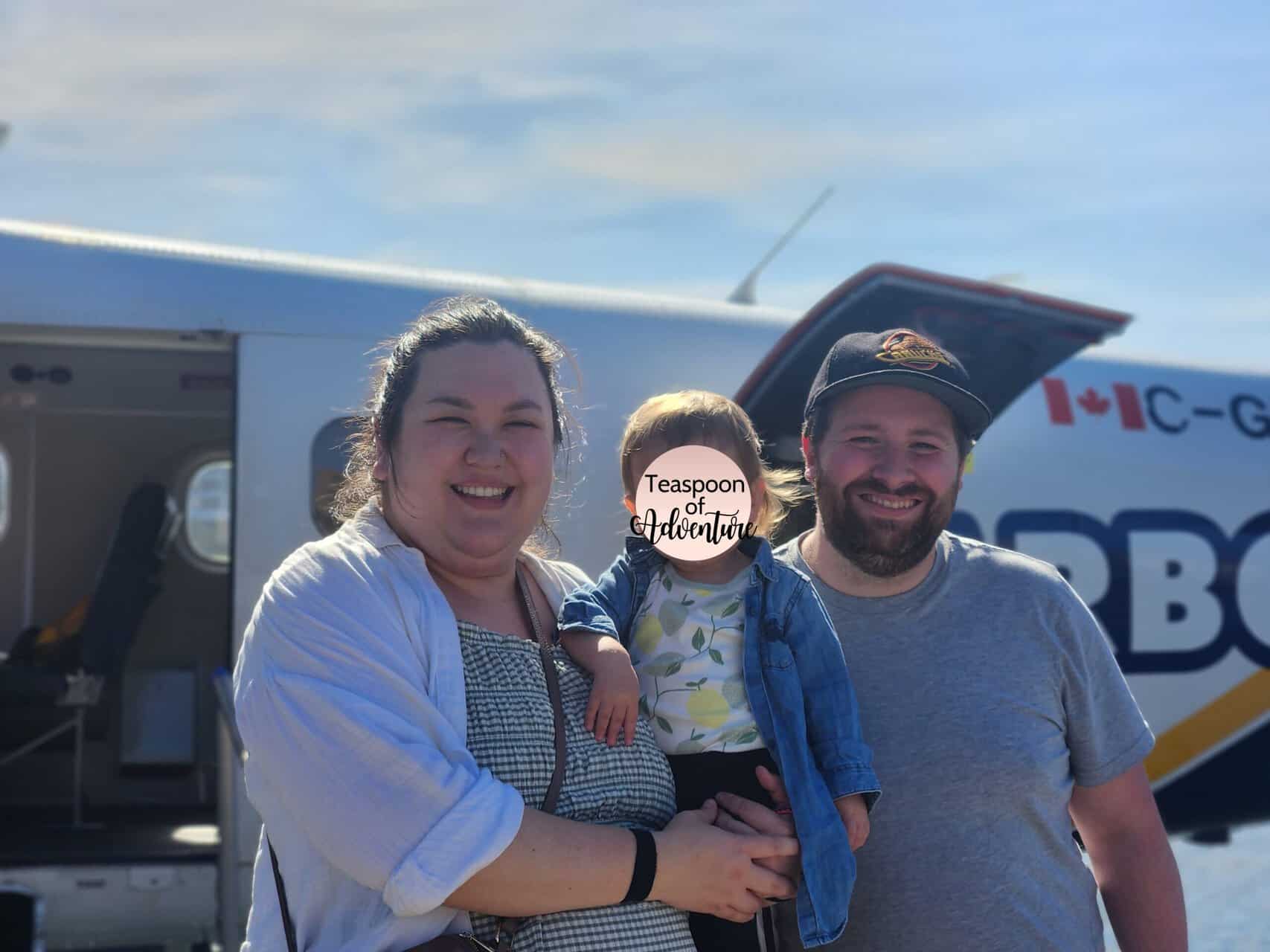 Should You Take a Seaplane to Victoria from Vancouver? (Harbour Air Review) 30 Riana, Colin and Baby C standing in front of a Harbour Air seaplane in Victoria Harbour