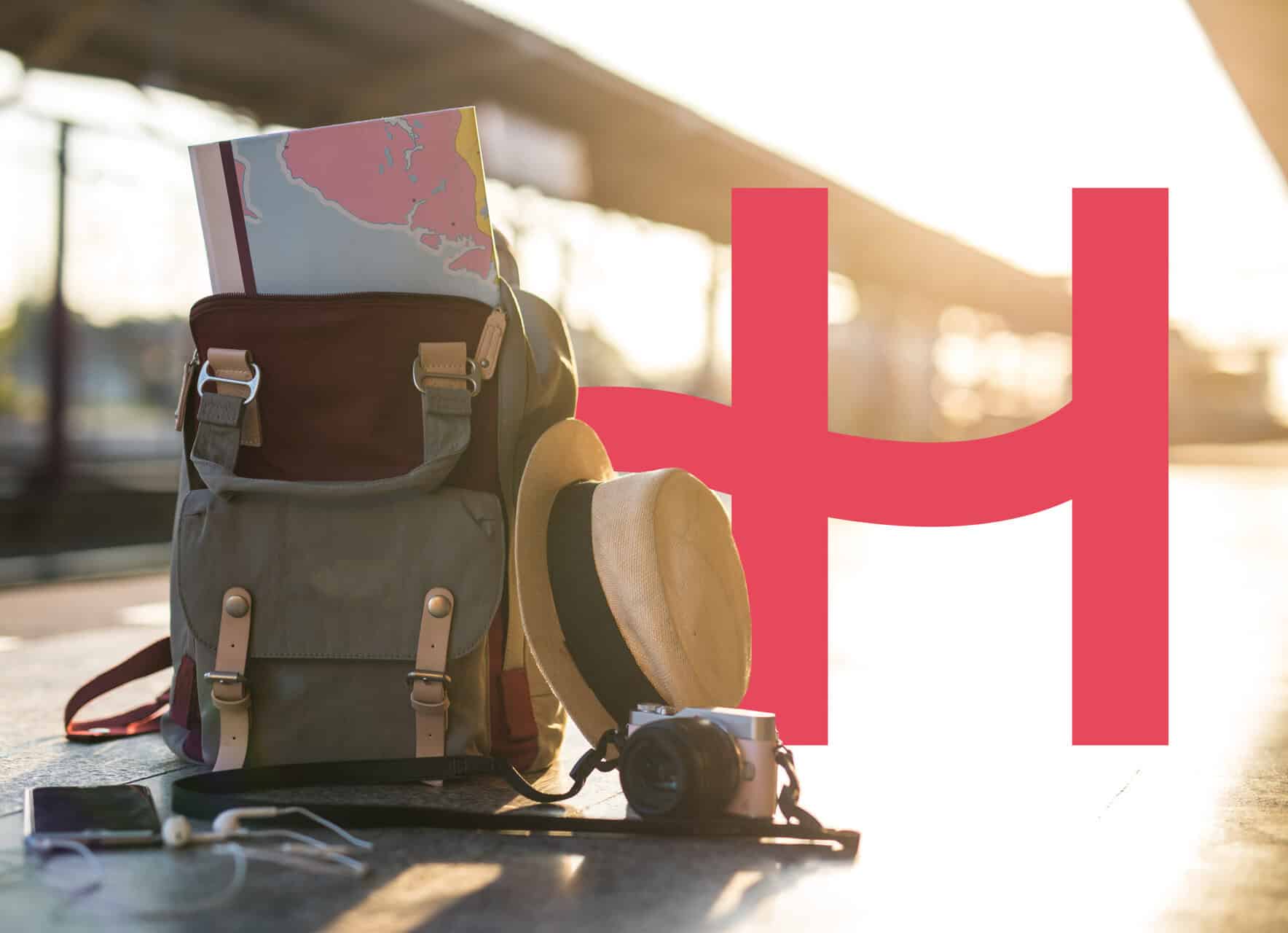 Why an eSIM Is Essential for Family Travel 3 Holafly logo next to backpack, hat and camera