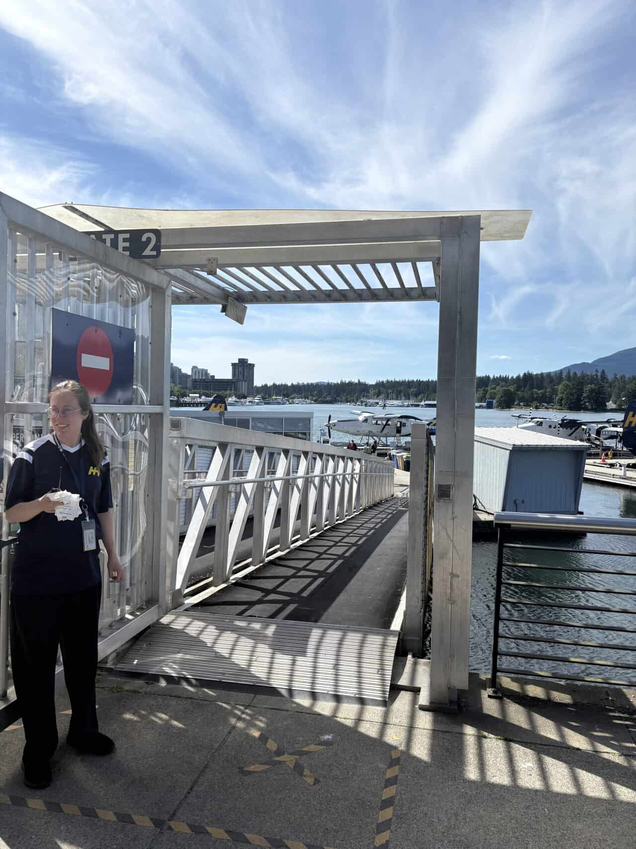 Should You Take a Seaplane to Victoria from Vancouver? (Harbour Air Review) 11 Gate agent checks our boarding passes as we make our way down to the dock at Vancouver Harbour to get onto a seaplane