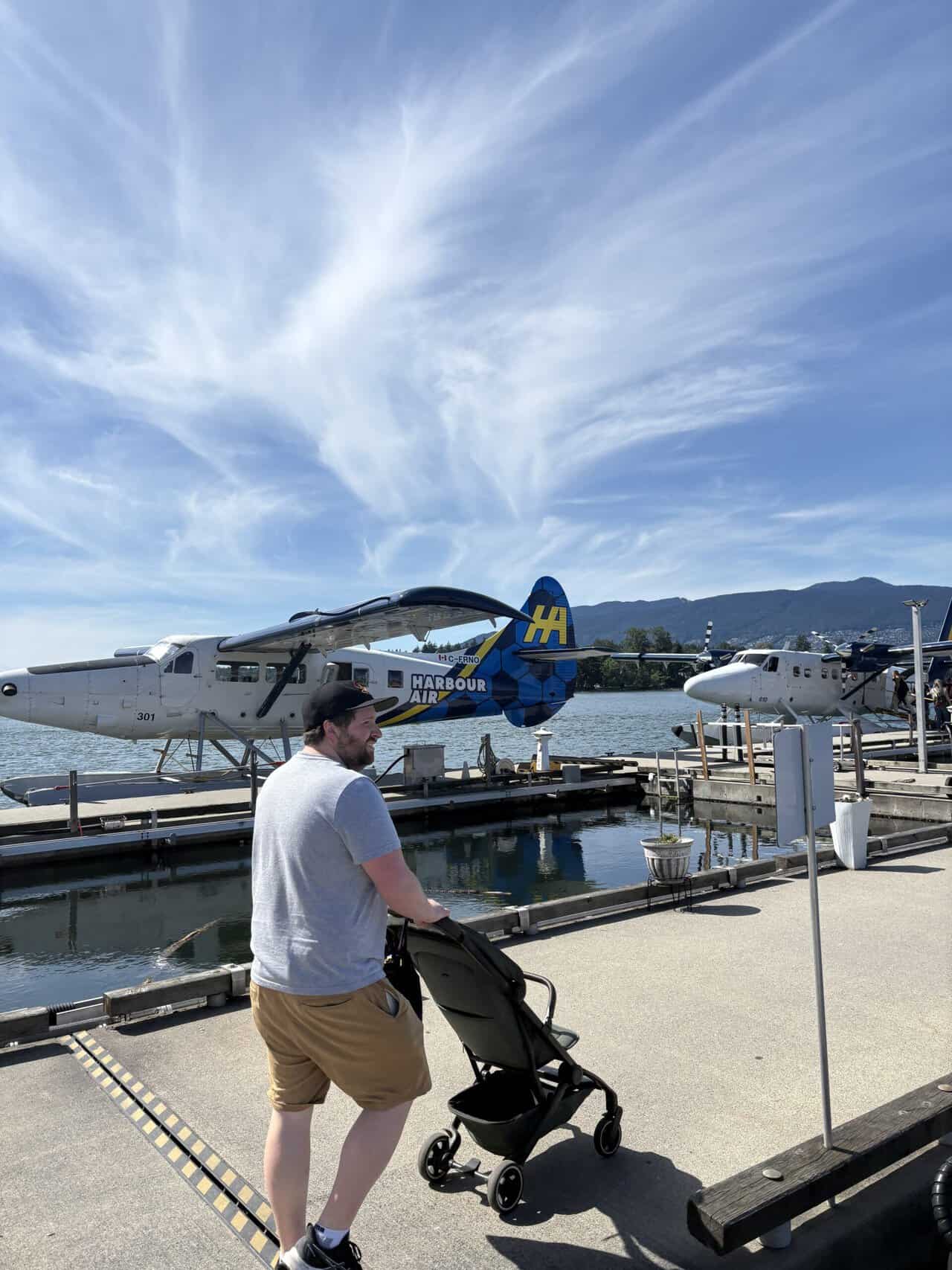 Should You Take a Seaplane to Victoria from Vancouver? (Harbour Air Review) 12 Colin pushing Baby C's stroller on the dock towards the seaplane
