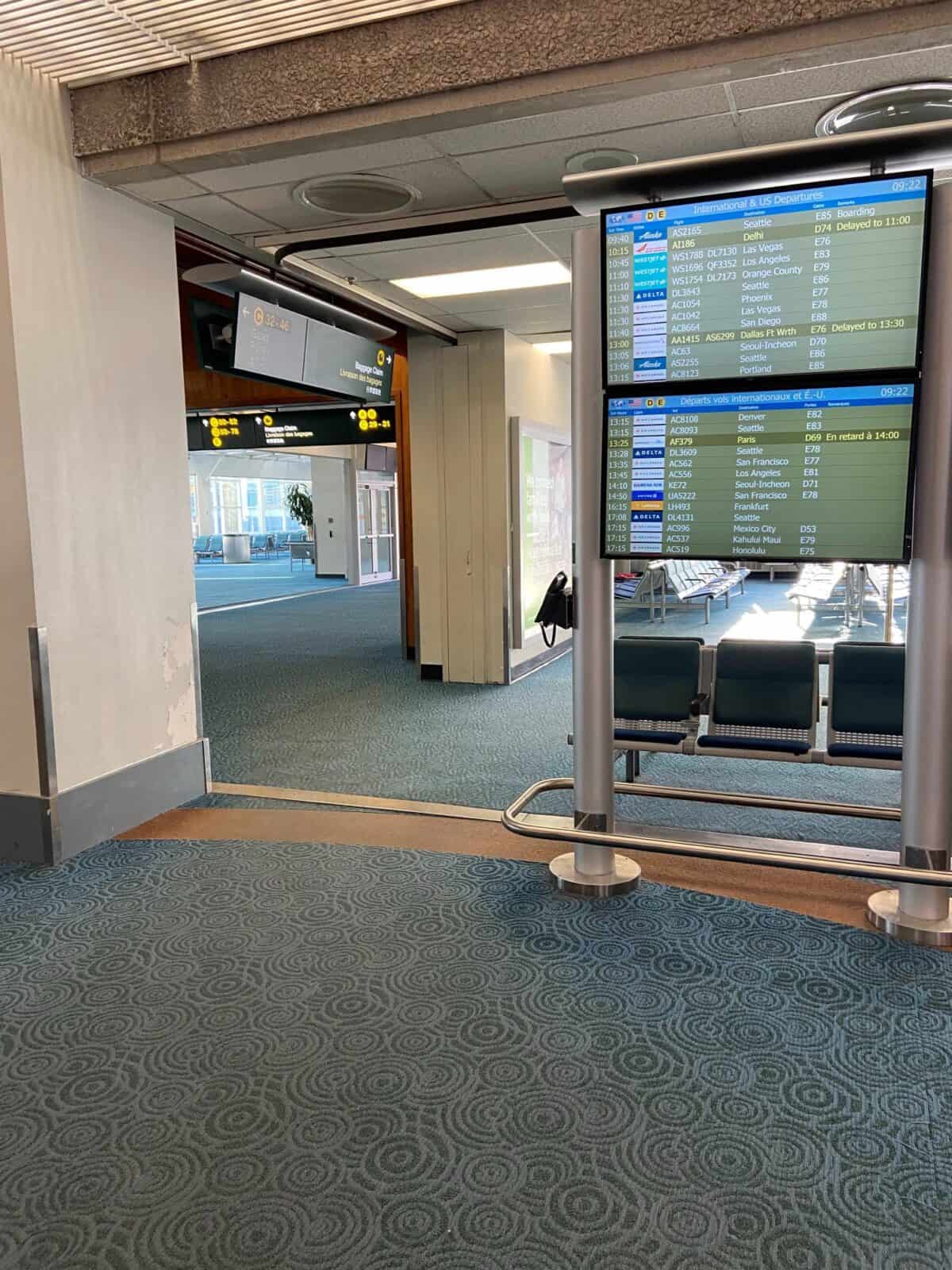 How to Get to Victoria from Vancouver, BC 16 YVR Vancouver International Airport. terminal with screens showing boarding gate information