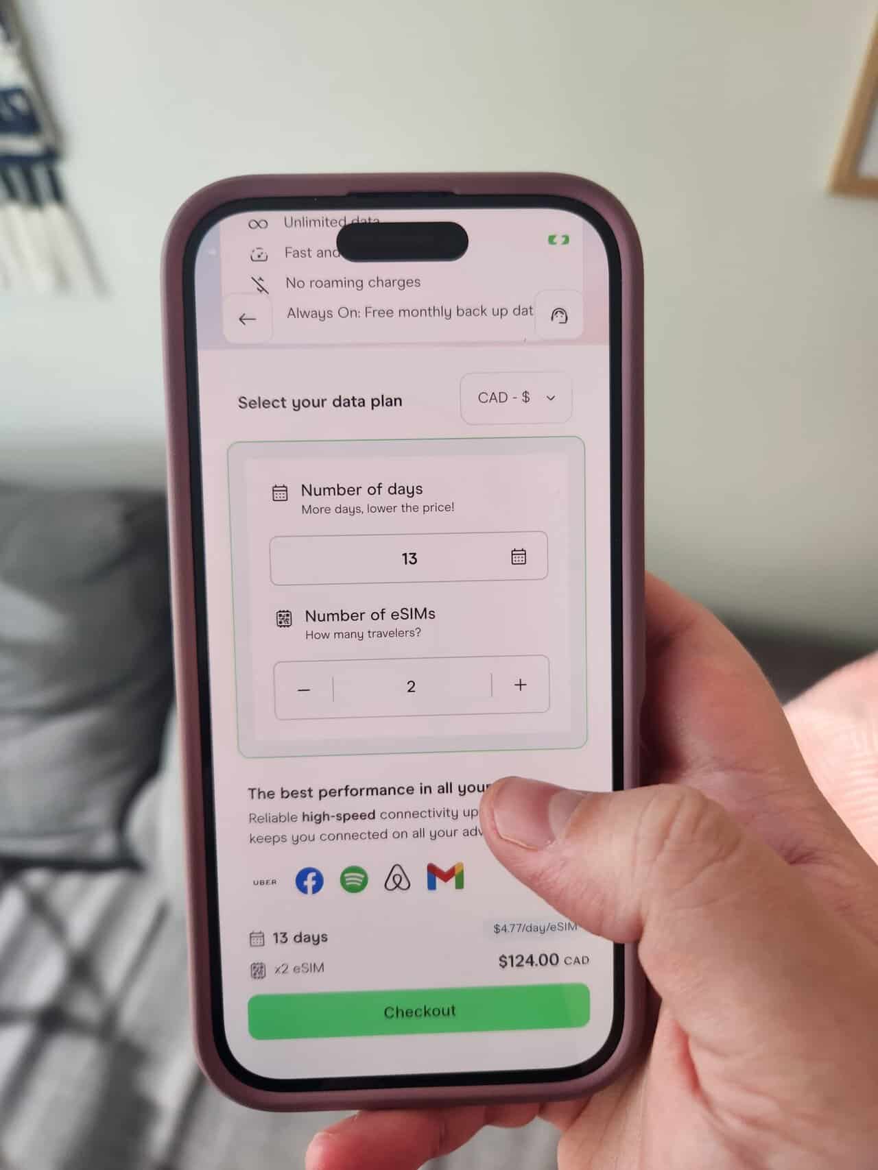 How to Set Up Your Holafly eSIM 5 Riana's hand holding her phone looking at a Holafly eSIM plan with dates and pricing