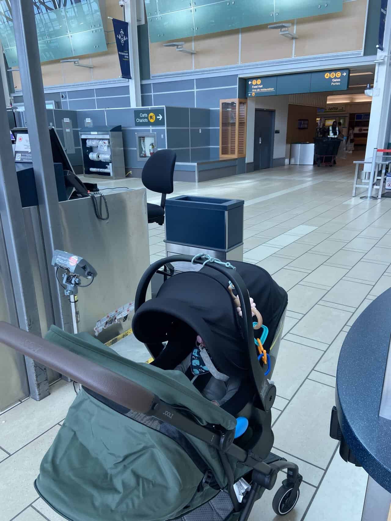Tips for Flying With a Baby: From Booking to Baggage Claim 29 C's stroller and car seat at the check in counter at YVR Airport